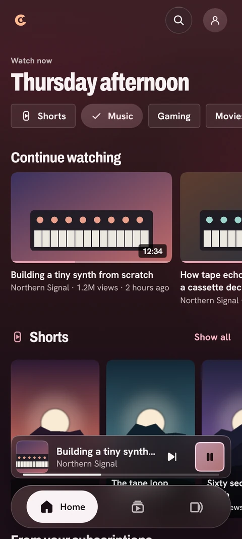Illustrative Cosmotune Video home screen with subscriptions and Shorts